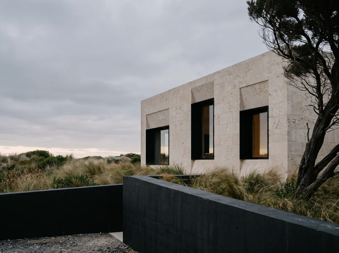 A quiet contemporary home with natural materials and a view into the landscape